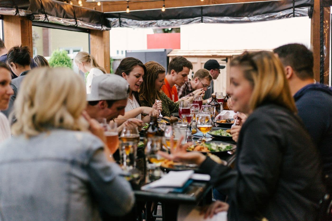 Group dining at an outdoor restaurant terrace, the kind of setting found along JBR
