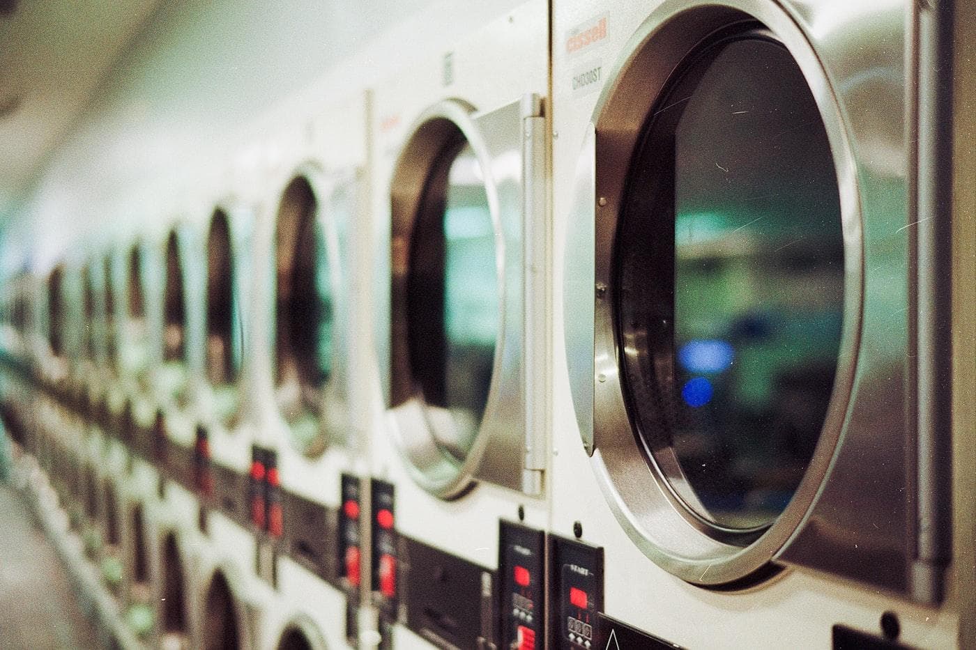 Neatly folded laundry stacked in a modern laundry facility